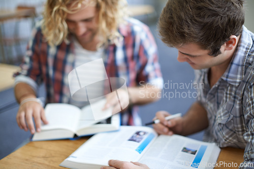 Image of Men, students and reading from textbook in university classroom for group work, education or research. Male people, friends and college lecture for test information or together, knowledge or learning