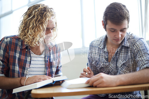 Image of Men, students and reading textbook in college with teamwork for education assignment, project or research. Male people, friends and group studying in university for lecture or learning, notes or exam