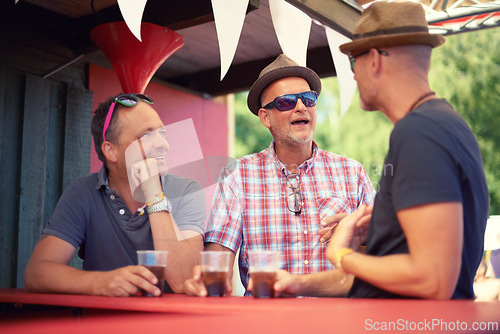 Image of Men, friends and drinking beer at music festival, talking and bonding together at social gathering. People, group and alcohol at party, carnival and concert for celebration event in summer outdoor