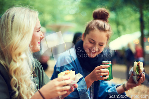 Image of Snack, women and music festival with friends, conversation and happiness with joy and bonding together. People, outdoor and girls with fast food and takeaway with summer break or concert with culture