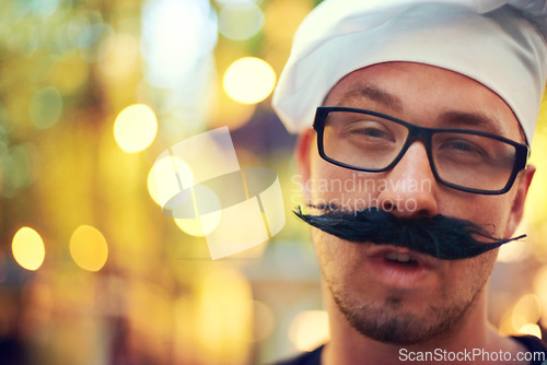 Image of Man, portrait or mustache and beret at festival for comic face, creative or confident in french fashion in nature. Person, glasses and happy in outdoor at carnival, bokeh and summer holiday in europe