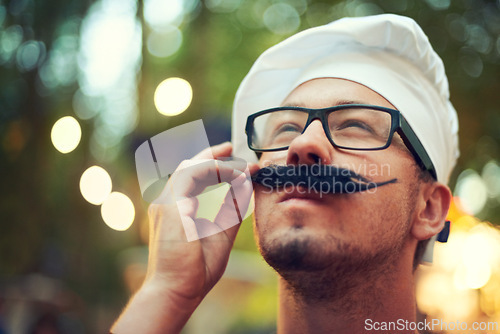 Image of Man, fake mustache and beret at concert with thinking in nature, creative idea and french fashion on vacation. Person, glasses and touch moustache for inspiration, muse and travel in bokeh in europe