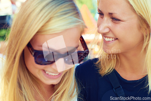 Image of Female friends, happy and closeup outdoors with smile for connection, bonding and unity together in Europe. Women, joy and looking down with glasses for laugh, fun and crazy adventure in forest