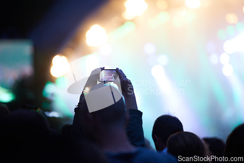 Image of Hands, cellphone and photography at music concert in crowd for social media post for holiday, carnival or night. Silhouette, photo and summer event or travel party or dark outdoor, lights or festival