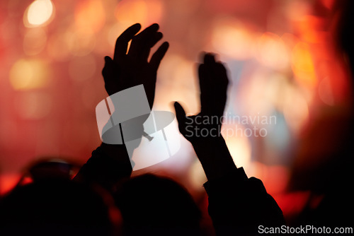 Image of Silhouette, hands and clap at music festival for concert entertainment for celebration, news years or carnival. Person, fingers and stage lights for live performance or crowd holiday, night or event