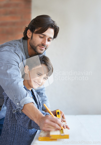 Image of Father, son and woodwork or teaching carpenter or measuring tape for helping, bonding or home repairs. Male person, child and face or parenting mentor for learning or furniture, lesson or building