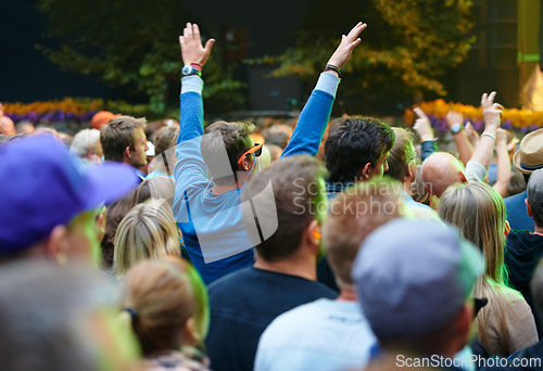 Image of Crowd, people and music festival with fans, cheering and happiness with celebration and event. Party, audience and outdoor with joy and shouting with New Years and excited for performance and sound