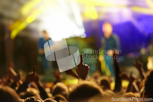 Image of Concert, audience and hand or sign with band for music festival, night club and cheering with energy. Disco, party and people with light, gesture and performance at rock event with entertainment