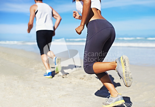 Image of Couple, sea and fitness with running, training and exercise for race in summer by the beach. Legs, athlete and workout of people by the ocean in Miami for health and wellness outdoor for sport