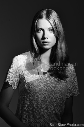 Image of Black and white, fashion and portrait of woman on dark background with beauty, style and trendy clothes. Monochrome, aesthetic and face of serious person with confident, pride or attractive in studio