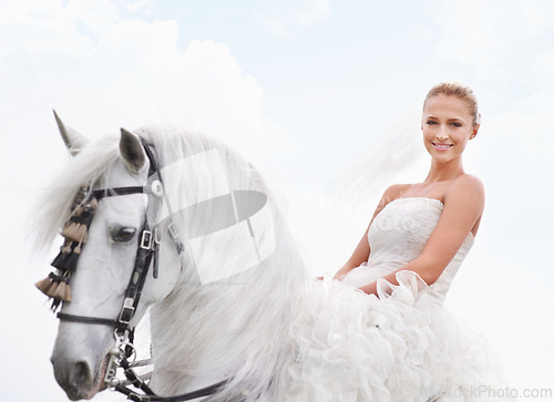 Image of Bride, woman and riding with horse or portrait outdoor with happiness for celebration, marriage and confidence. Wedding, person and stallion on lawn in field with smile, dress and animal at ceremony