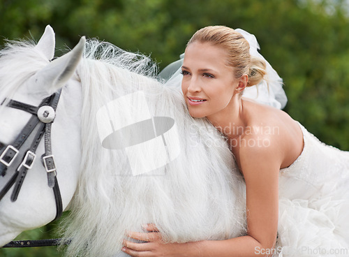Image of Wedding, woman and riding with horse in nature and happy for celebration, marriage and confidence in countryside. Bride, person and stallion on lawn in field with smile, dress and animal at ceremony