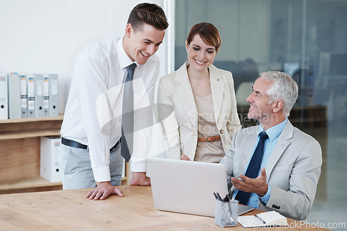 Image of Laptop, meeting and business people in discussion in office for corporate legal project. Conversation, technology and professional team of lawyers working on computer by desk together in workplace.