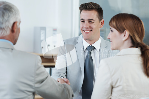 Image of Shaking hands, interview and hr with candidate in office for business meeting, discussion or recruitment. Handshake, hiring and man talking to human resources managers in workplace boardroom.