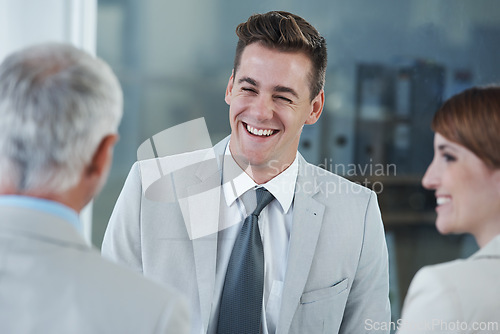 Image of Smile, interview and hr with candidate in office for business meeting, discussion or recruitment. Happy, hiring and man talking to professional human resources managers in workplace boardroom.