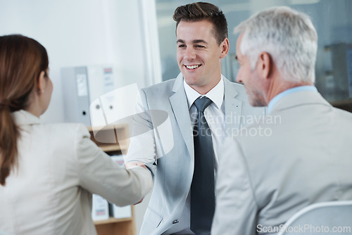 Image of Shaking hands, interview and hr with candidate in office for business meeting, discussion or recruitment. Handshake, hiring and man talking to human resources managers in workplace boardroom.