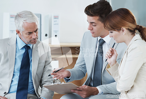 Image of Business people, talking or lawyer with contract for paperwork, strategy or notes at office. Financial advisor, teamwork or employees with documents, deal or legal advice in meeting for consultation