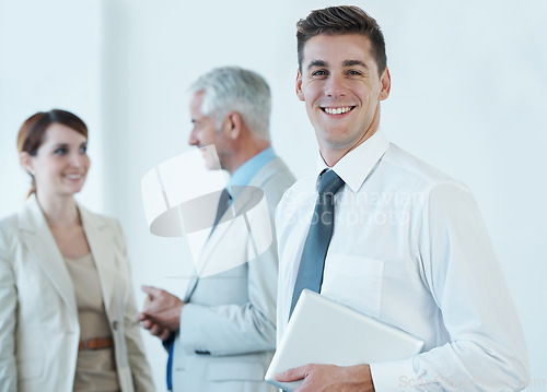 Image of Portrait, smile and business man with tablet in office for start of corporate career as professional intern. Technology, trust and happy young employee in boardroom of workplace with colleagues