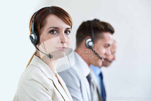 Image of Call center, serious or portrait of woman in customer service, business support and CRM in office. Face, advisor or telemarketing agent in mic headset ready for telecom consulting in coworking agency