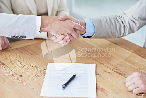 Image of Handshake, business people and contract, onboarding with human resources, meeting or interview at office. Paperwork, cooperation and partnership with signature, hiring and shaking hands for welcome