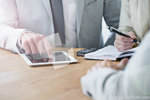 Image of Hands, tablet and business people meeting in office closeup for planning, strategy or agenda schedule. Collaboration, technology and writing in notebook with corporate employee group at workplace