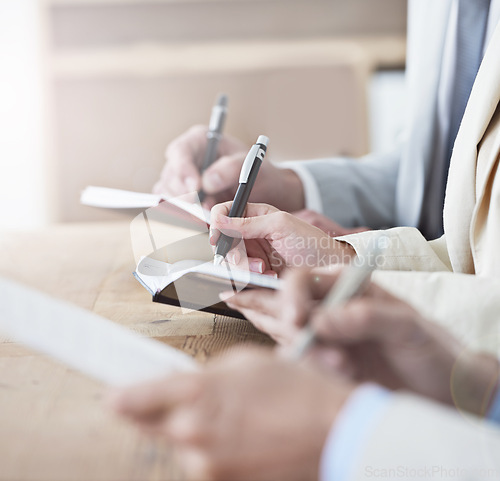 Image of Hands, writing and meeting with business people in boardroom of office or seminar or upskill development. Learning, training and growth with employee group in audience or crowd for workshop closeup