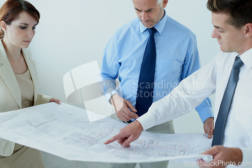 Image of Blueprint, people or civil engineering team planning project, maintenance or renovation in meeting. Architecture, office building or group of designers with floor plan for property development ideas