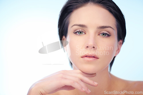 Image of Skincare, model or portrait of woman in studio isolated on blue background for wellness or anti aging. Smooth, spa or natural dermatology results of lady or confident person with beauty, face or glow