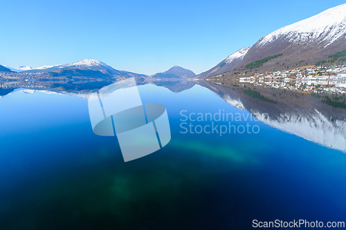 Image of Serene winter morning over the sea in a mountainous region