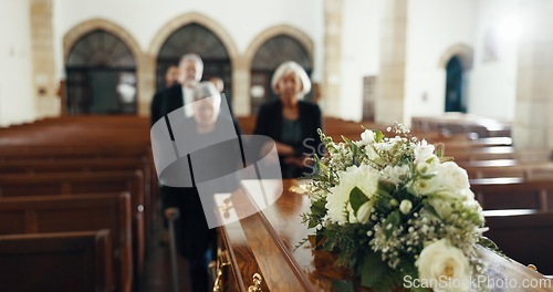 Image of Funeral, church and people with coffin for goodbye, mourning and grief in memorial service. Depression, family and sad senior women with casket in chapel for greeting, loss and burial for death