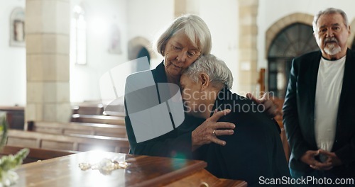 Image of Senior women, coffin and funeral in church for memory, support and condolences with religion with family. Community, friends and together for death, loss and service with empathy, faith and casket