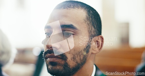 Image of Sad, man and face closeup with depression at a funeral in church for religious service and mourning. Grief, male person and burial with death, ceremony and grieving loss at chapel event in a suit