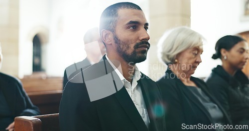 Image of Sad, man and face closeup with depression at a funeral in church for religious service and mourning. Grief, male person and burial with death, ceremony and grieving loss at chapel event in a suit