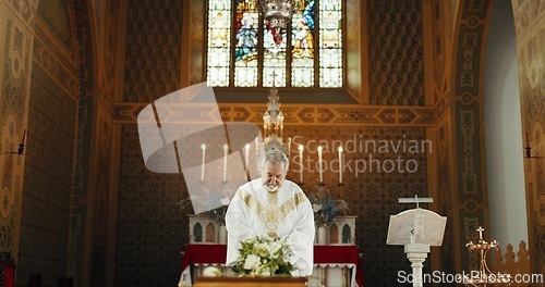 Image of Funeral, church and priest with prayer by coffin for memorial service, sermon and ceremony for death. Religion, guidance and male pastor praying with congregation for comfort with casket in chapel