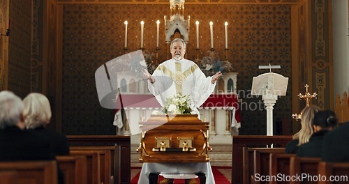 Image of Funeral, church and pastor with prayer by coffin for memorial service, sermon and ceremony for death. Religion, guidance and male priest praying with congregation for comfort with casket in chapel