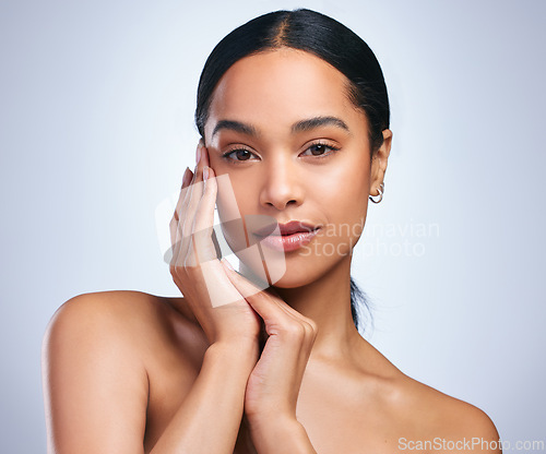 Image of Self determined worth. a beautiful young woman posing against a grey background.