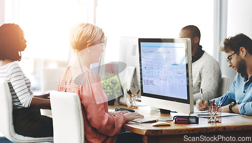 Image of Group, business people or work on computer in office, diversity or typing or reading of online application. Workplace, productivity or consultants by desktop on research or website for connectivity