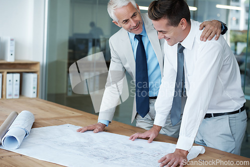 Image of Boss, manager and architect with embrace, plan and vision for expanding in office for space. Executive, employer and blueprint at desk, company and meeting for renovation idea in project for ceo