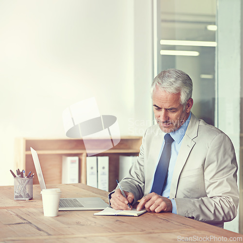 Image of CEO, businessman and writing with laptop, plan and vision for expanding office and boardroom. Executive, senior employer and diary notes at desk, company and thinking for of new idea in firm project