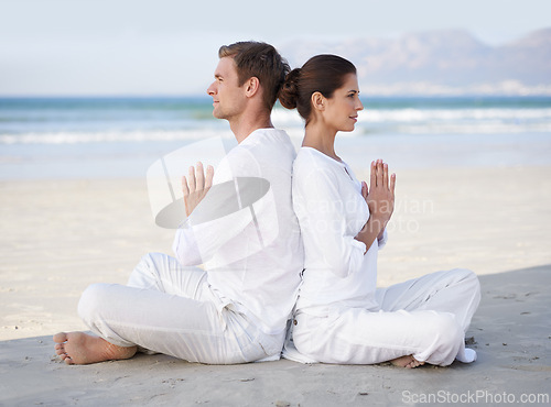 Image of Couple, yoga and beach with meditation, sitting and peace on sand in morning with mindfulness in summer. Man, woman and outdoor for namaste with spiritual growth, balance or zen by ocean in Cape Town