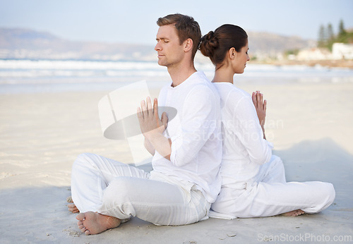 Image of Couple, yoga and beach with meditation, peace and sitting on sand in morning with mindfulness in summer. Man, woman and outdoor for namaste with spiritual growth, balance or zen by ocean in Cape Town