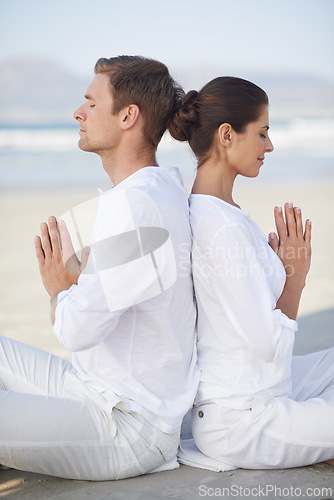 Image of Couple, yoga and sea with meditation, peace and waves on sand in morning with mindfulness in summer. Man, woman and outdoor for namaste with spiritual growth, balance and zen at beach in Cape Town