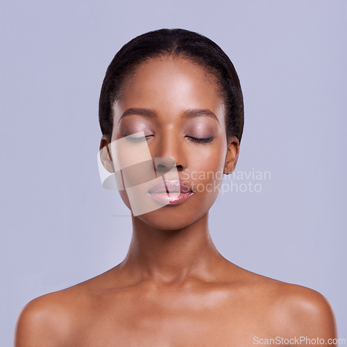 Image of Face, makeup and skin of black woman for beauty, healthy glow and natural cosmetics with wellness on grey background. Eyes closed, peace and calm for dermatology, antiaging and skincare in studio