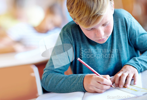 Image of Student, boy and drawing for learning in classroom, book and problem solving at school. Male person, child and study information for exam prep in notebook, math solution and ruler for assessment