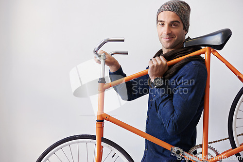 Image of Man, studio and bike for eco friendly, portrait and transportation on white background. Hipster cyclist, carbon neutral and sustainability travel for environmental commute or fitness and trip