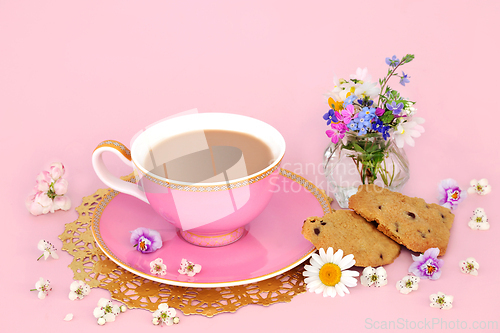 Image of Cup of Tea with Chocolate Chip Cookies and Spring Flowers  