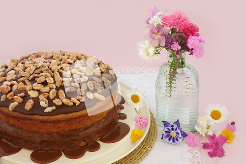 Image of Homemade Peanut and Caramel Sauce Cake with Summer Flora