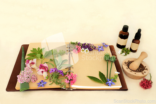 Image of Preparing Aromatherapy Essential Oil with Herbs and Flowers