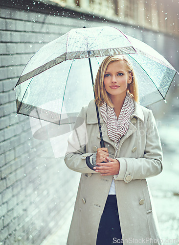 Image of Woman, umbrella and walking with rain in street, thinking or ideas with cover, weather and memory in city. Person, outdoor and road with travel, journey or commute in winter on sidewalk in Cape Town