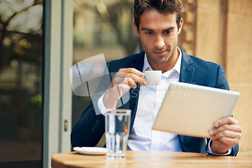 Image of Businessman, reading and outdoor at cafe with tablet for news, article or internet research in London. Online, communication and drink espresso with tech for social media and scroll blog on website